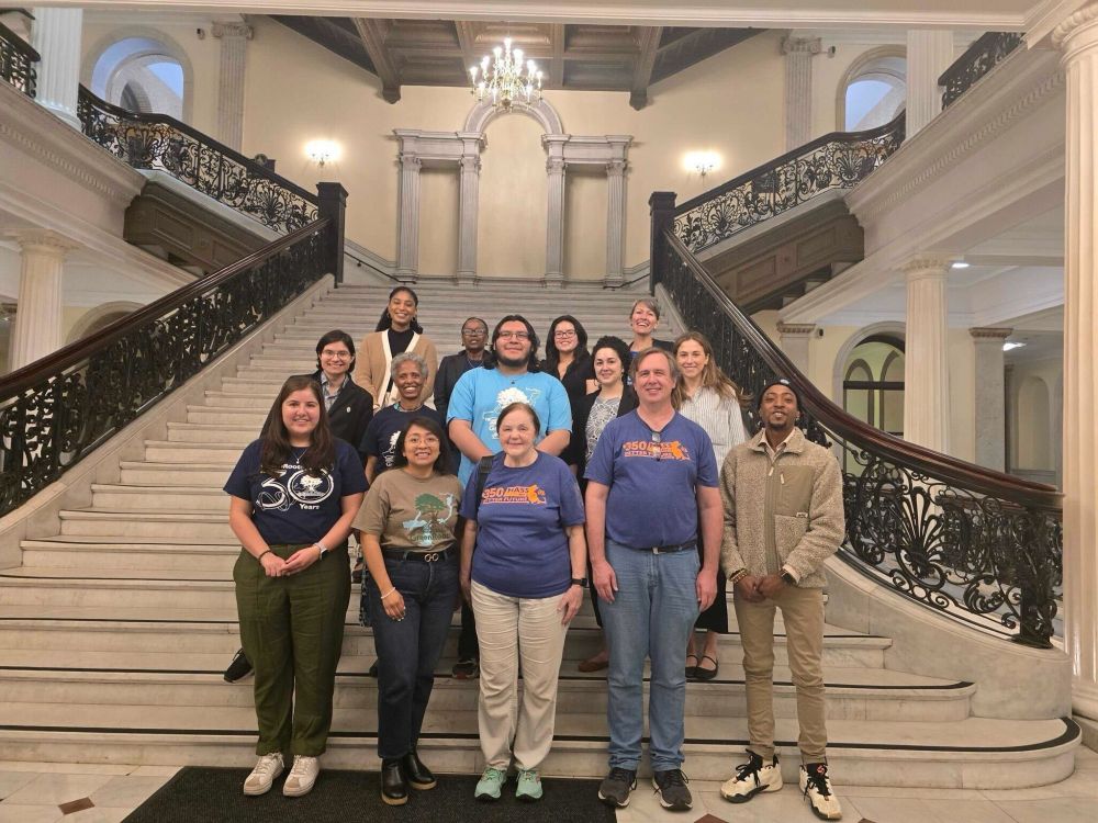 Advocates pose on the fanciest staircase in the Massachusetts State House