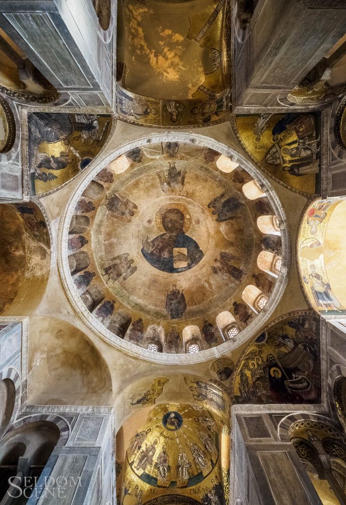 Mosaics, some faded, cover the domes and adjoining ceiling spaces of the Church of Saint Luke.