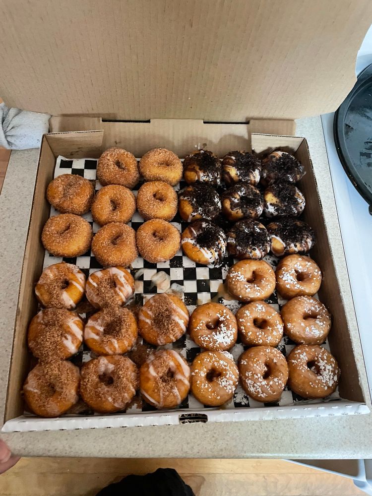 A huge box of assorted mini donuts. 