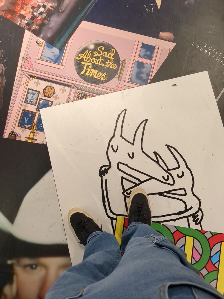 the floor at Rough Trade Below NYC. the Twin Fantasy cover is printed on the floor among several other albums. I am stepping on it. not out of desire, or shame, nor a simple desire to feel pain. I just think it's funny