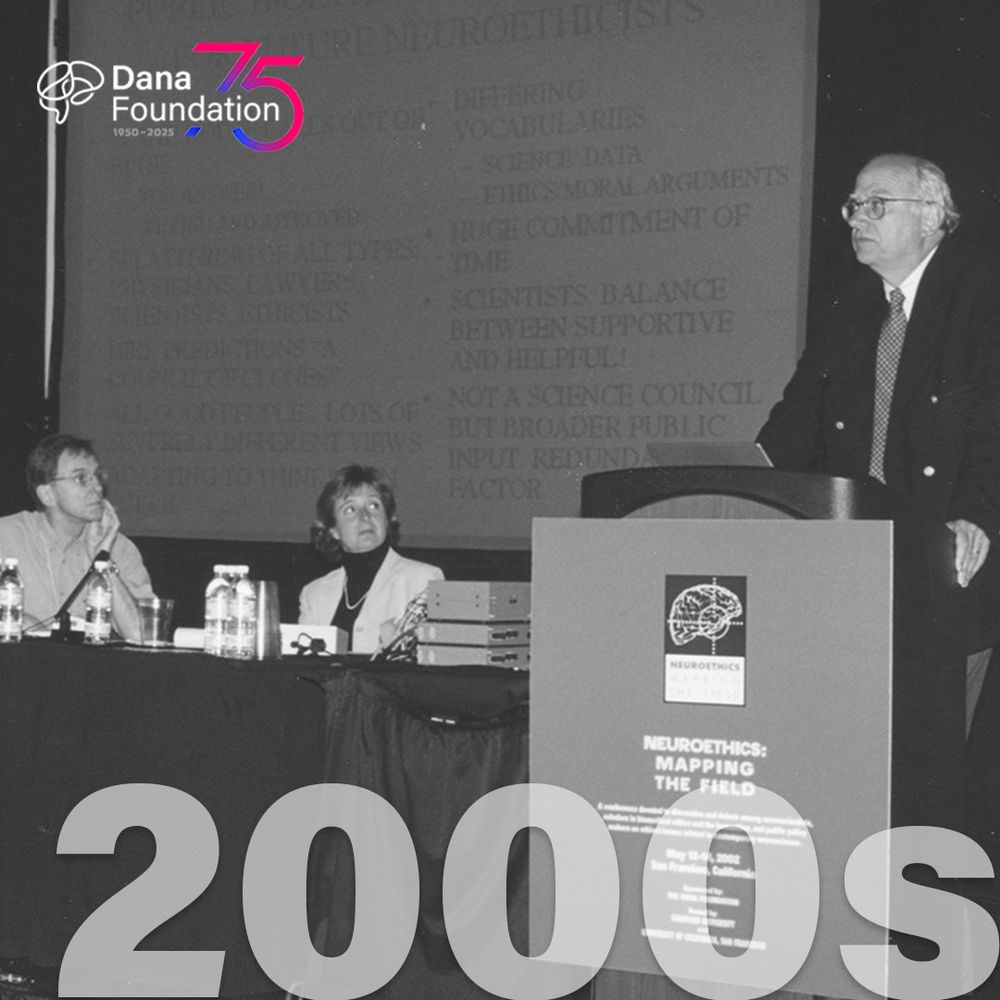 A panel discussion at a Dana Foundation event, featuring three speakers sitting at a table and one standing at a podium in the foreground, with a backdrop titled "Neuroethics: Mapping the Field". The scene is from the early 2000s, indicated by the large "2000s" graphic on the image.