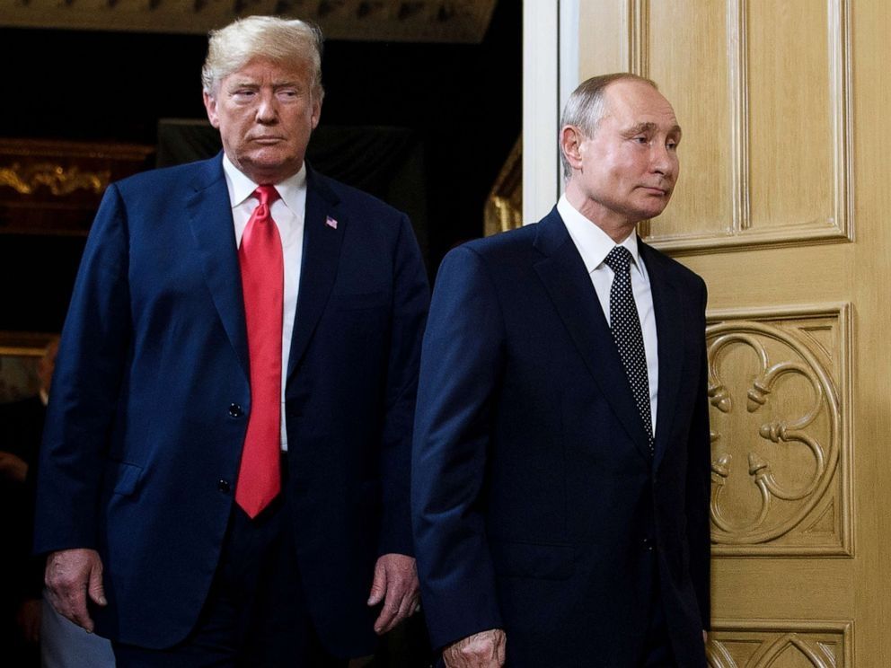 Donald Trump follows Vladimir Putin through a doorway after their meeting in Helsinki in 2018. Trump's eyes are narrowed as he looks at Putin, a look of anger combined with fear. Putin wears a barely concealed smirk, looking for all the world like the cat who just swallowed the canary.
