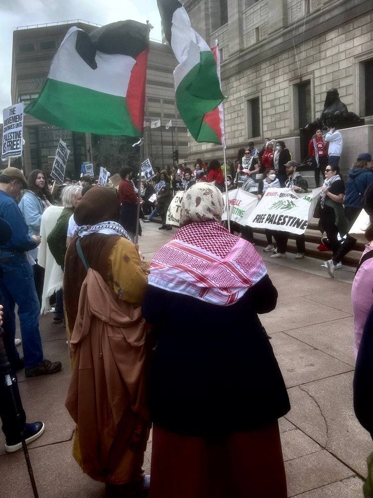 Demonstration for Mahmoud Khalil in Boston on March 16, 2025. Two women dressed in traditional Muslim clothing, hold Palestinian flags.