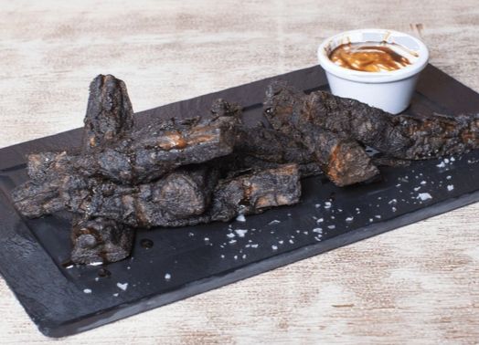 charred sticks with mashed potatoes