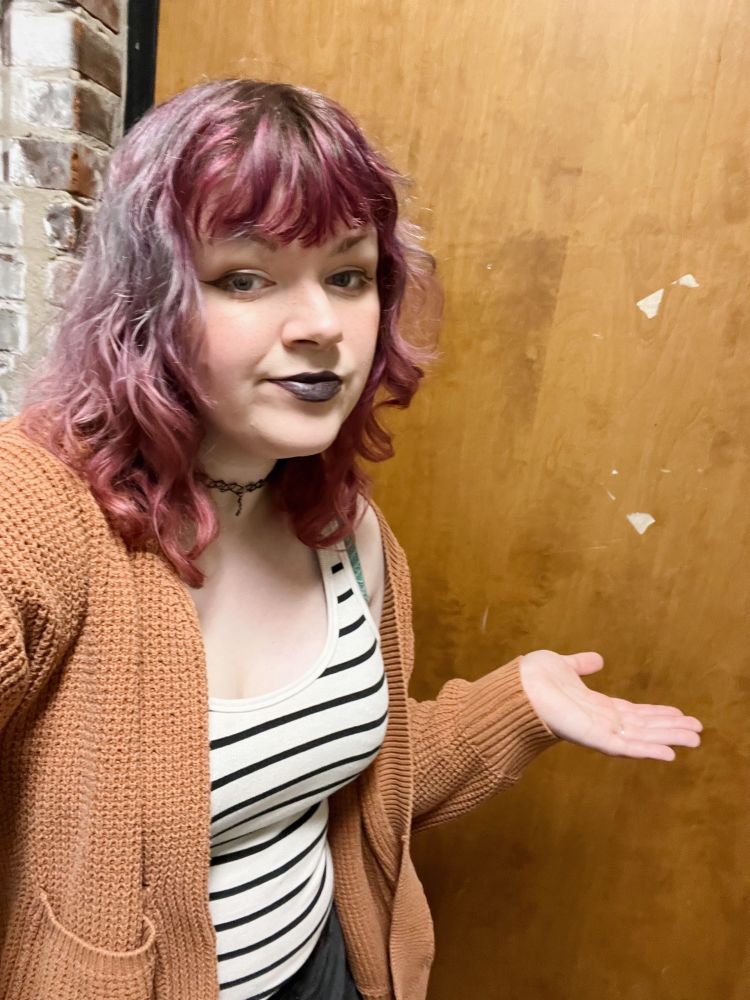 skyler in front of one side of a bigass door..