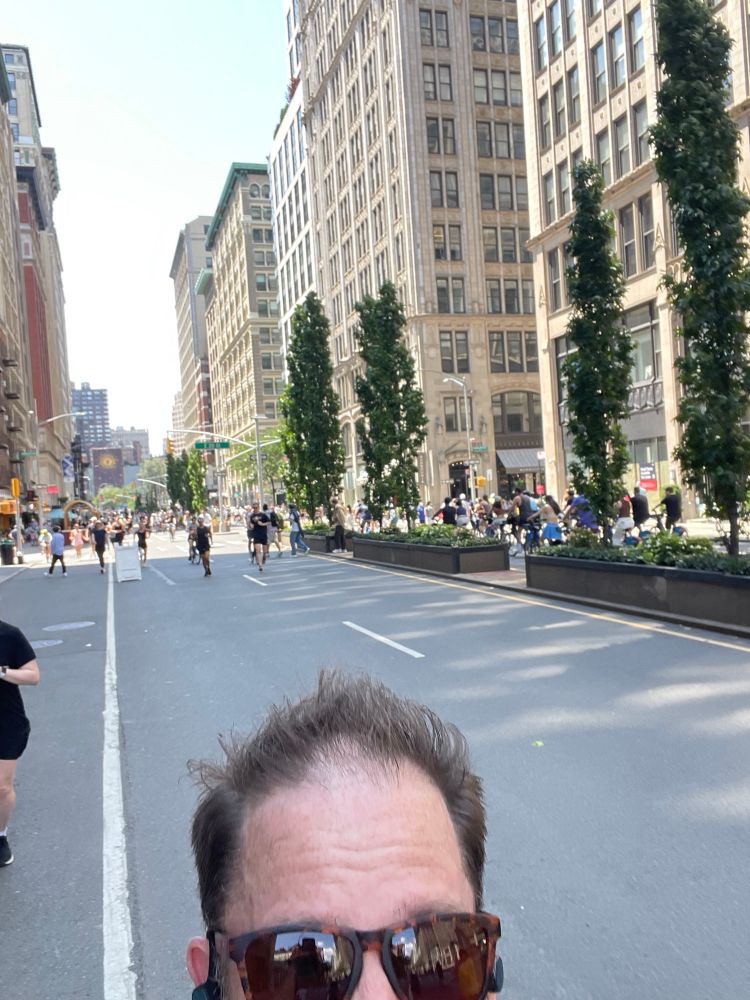 My giant forehead. Also people running along the street behind me