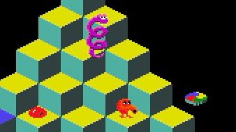 Picture of q*bert and a coiled snake on a pyramid of yellow and green cubes