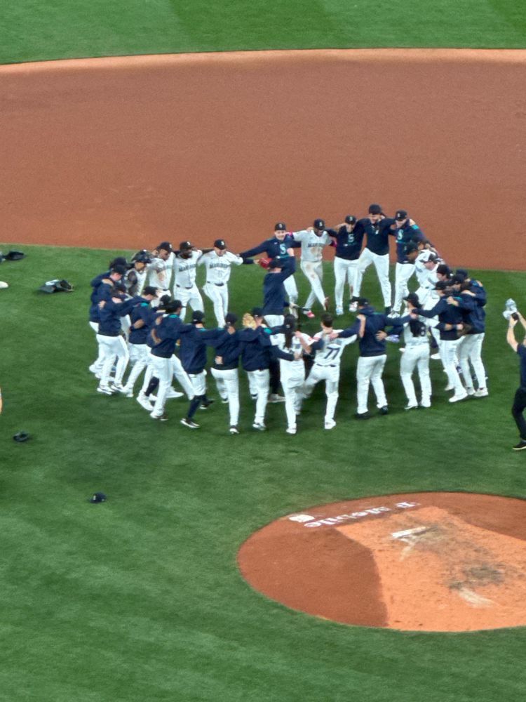 The Seattle Mariners dancing in a circle after winning the American League West T-Mobile Park 9/24/25