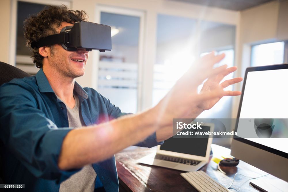 white guy in a vr heqadset holding his hands in front of him like he's about to honk boobs