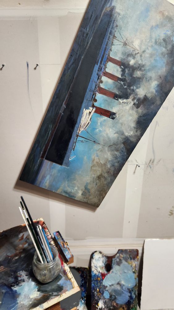 Oil painting of the RMS Lusitania han8ng at an odd angle wile I apply a wash of browns over the upper right areas of this 17"×34" canvas
