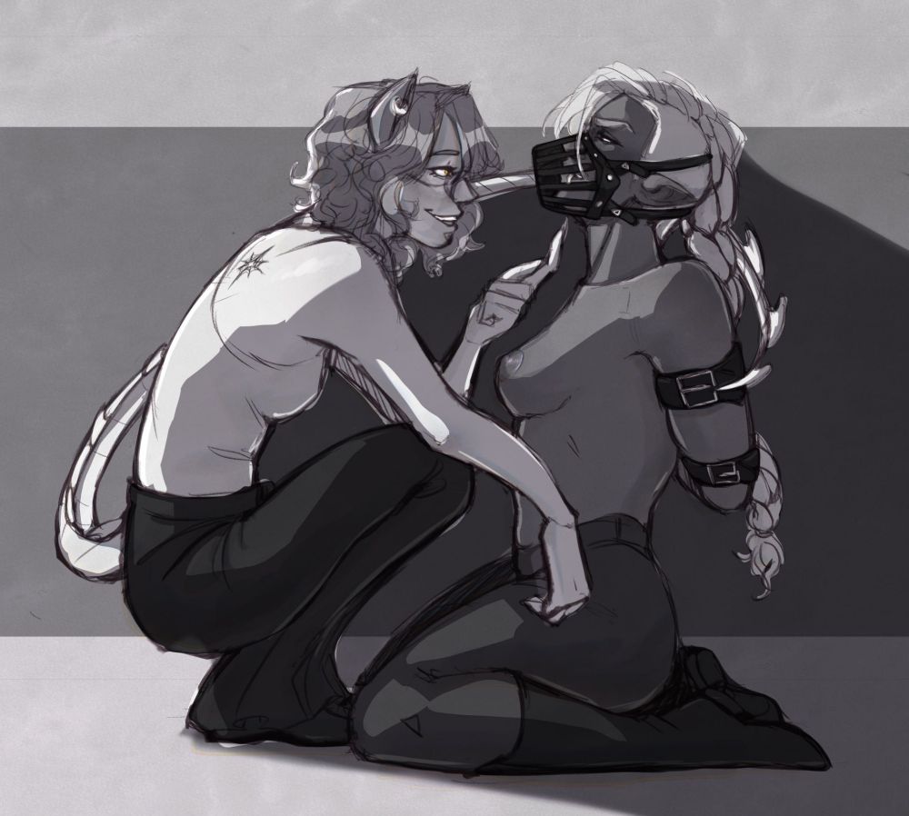 A b&w illustration of Fenix (they/them) squatting in front of Ro (she/her) taunting her as her arms are bound by leather straps and she wears a leather muzzle on her face. 