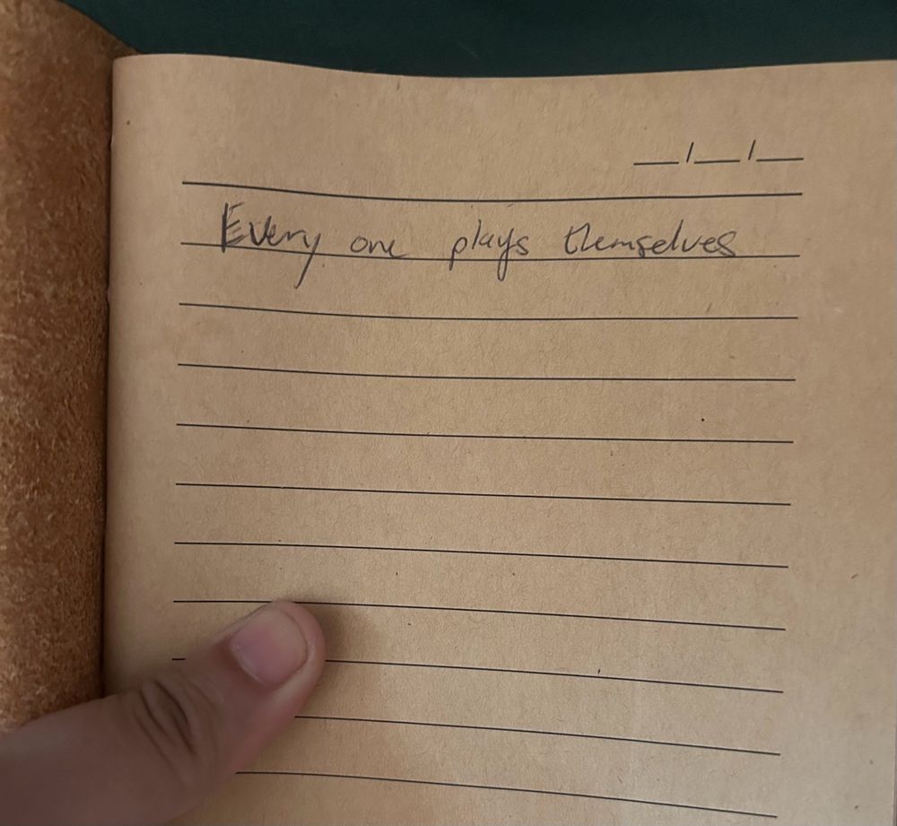 The first page of a journal. The single line, written by 23 year old me, reads “every one plays themselves”