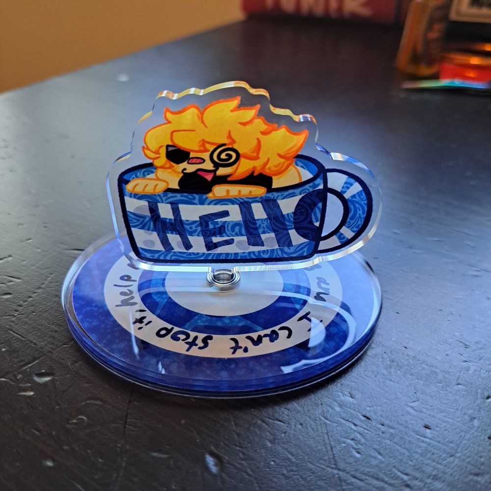 Artwork of sin kiske chillin in a mug, an acrylic standee that spins