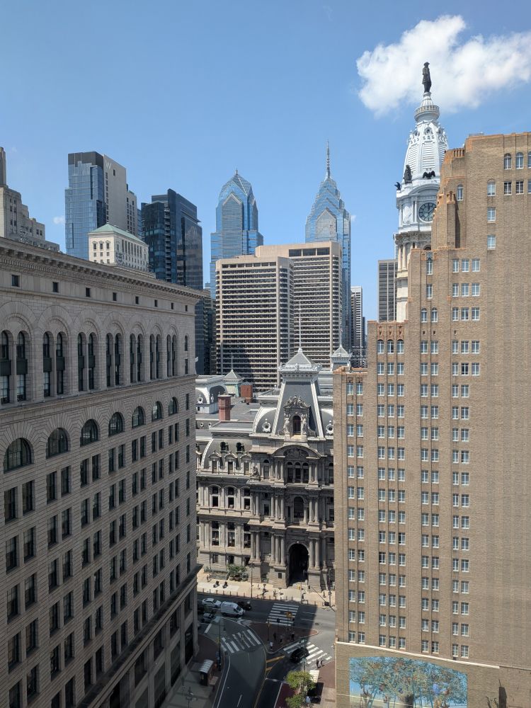 downtown Philadelphia, the city hall building nestled among skyscrapers