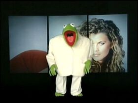 Kermit the Frog in an oversized suit from the Muppet’s rendition of “Once in a Lifetime” by the Talking Heads. 