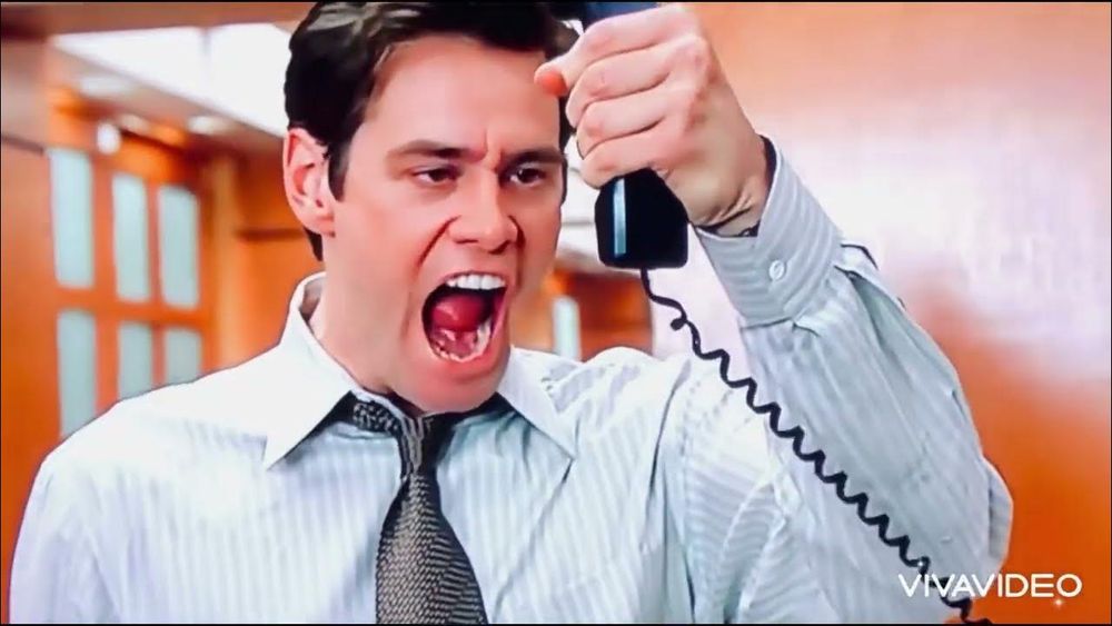 Jim Carrey yelling into a phone
