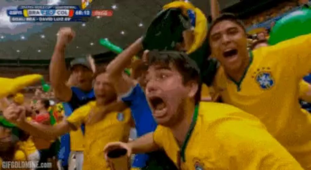 a group of soccer fans are celebrating a goal during a game sponsored by espn