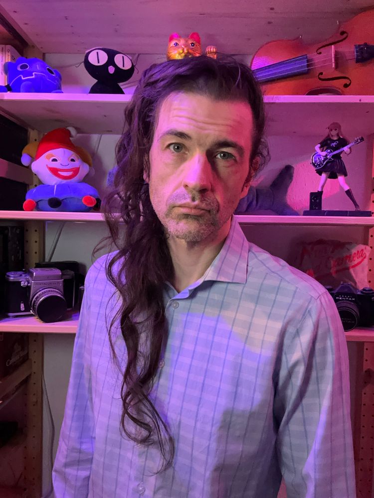 Some middle aged white dude with hair that has been growing for 1720 days 