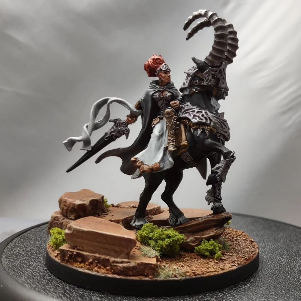 Morvanah the Autumblade for Hordes riding an Ibex with desert stones. 
