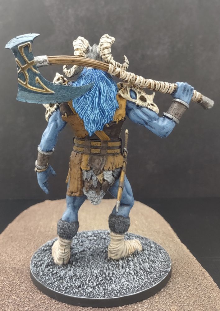 Rear view of the Gale force 9 frost giant reaver hand painted by me with blue skin and leather armor with a massive axe slung over his shoulders. 
