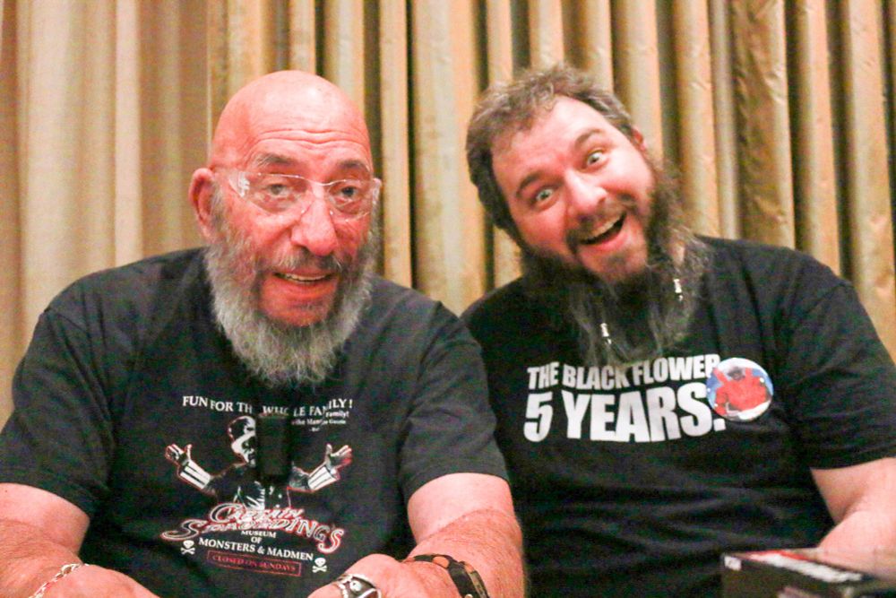 Sid Haig and Magnus sitting together.