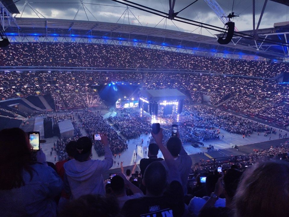 AEW All In 2023, Wembley Stadium at dusk with added phone torches (from quite high up!)