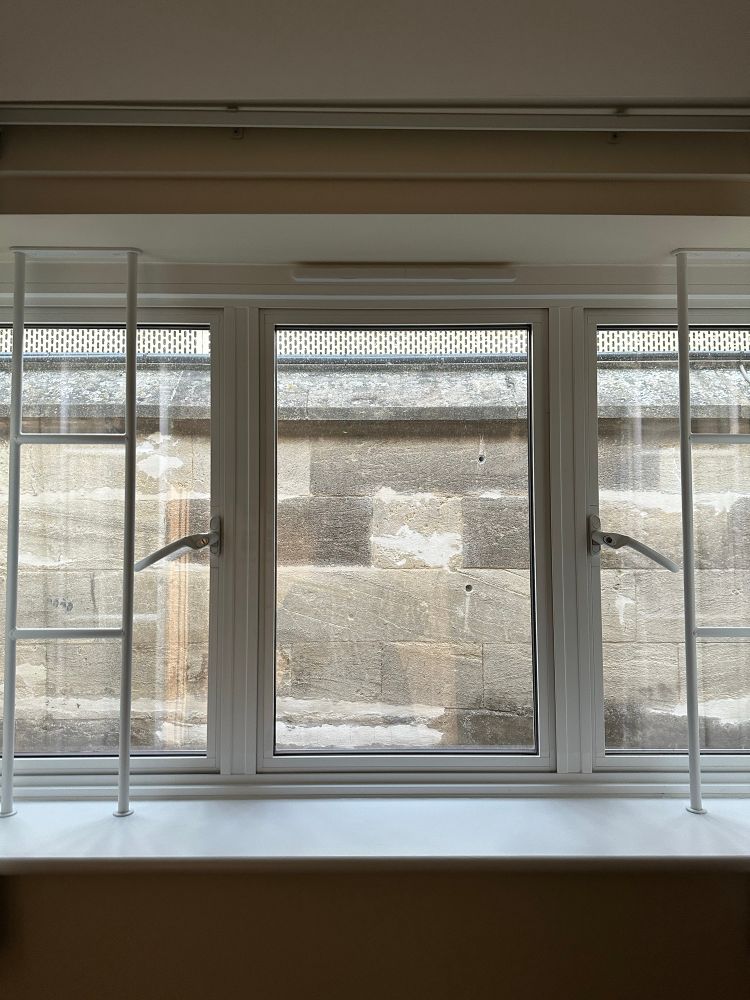 View out of a window to a wall 