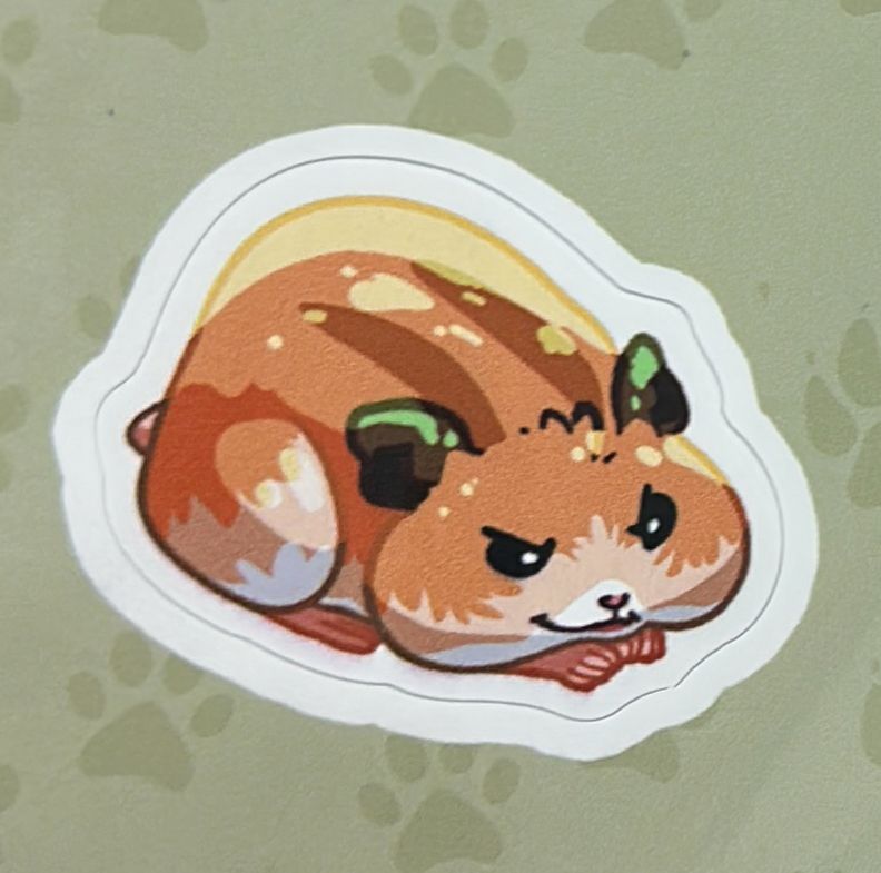 Foto de perto do adesivo do hamster Boo na cartela de adesivos de pets de Baldur’s Gate 3, com expressão calculista. 