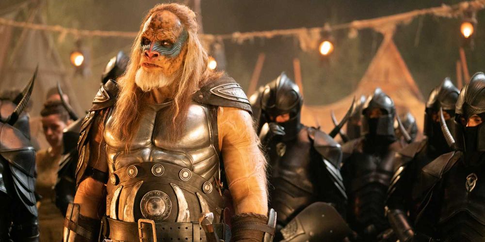 Lord Karlak (Martyn Ford), giant ape man warrior in 2025 Red Sonja. he's like two heads taller than all the other soldiers