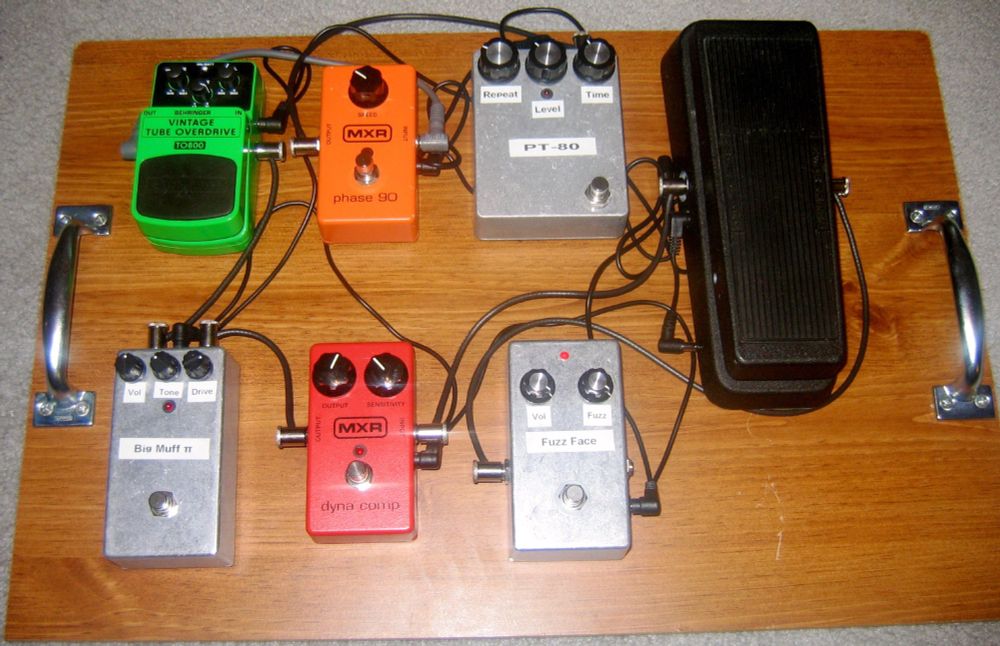 I only started discovering pedal kits at this point, so I still have my original MXR Phase 90 and Dynacomp as well as my Behringer TO800 Tube Screamer Clone (which is actually a really good sounding pedal in the cheapest plastic enclosure possible without being a ziplock baggie). So we have a GGG (General Guitar Gadgets) Fuzz Face -> GGG Mod Wah -> Dynacomp -> GGG Big Muff Pi -> TO800 -> Phase 90 -> GGG Analog Delay