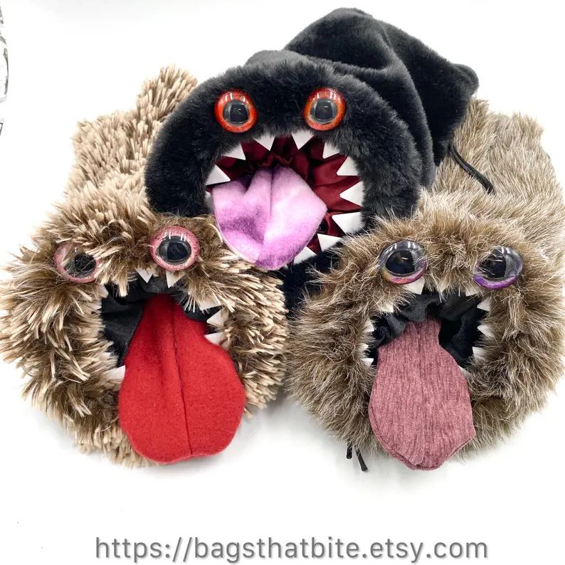 3 large bags of devouring (favorite food is dice!) round mouth drawstring bags with teeth and hand painted eyes. They all have tongues that will empty everything you fed the monster when you pull them. 