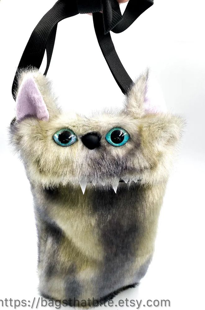 Purse that resembles a Siamese cat. 