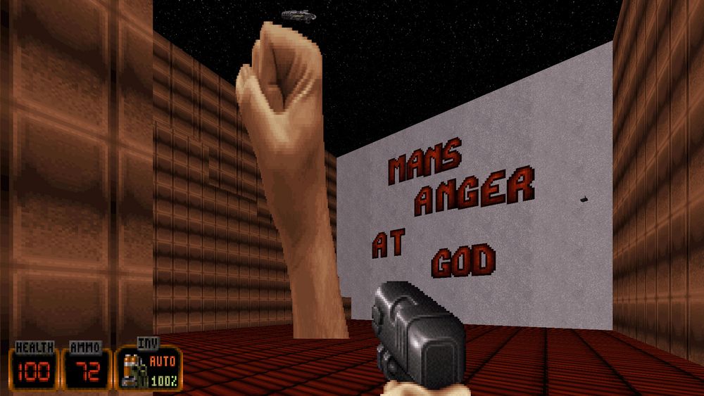 Room in Duke3D usermap 'carni2.map' with a fist sprite scaled to giant proportion, contextualized as an art display with the accompanying text 'Man's Anger At Cod'
