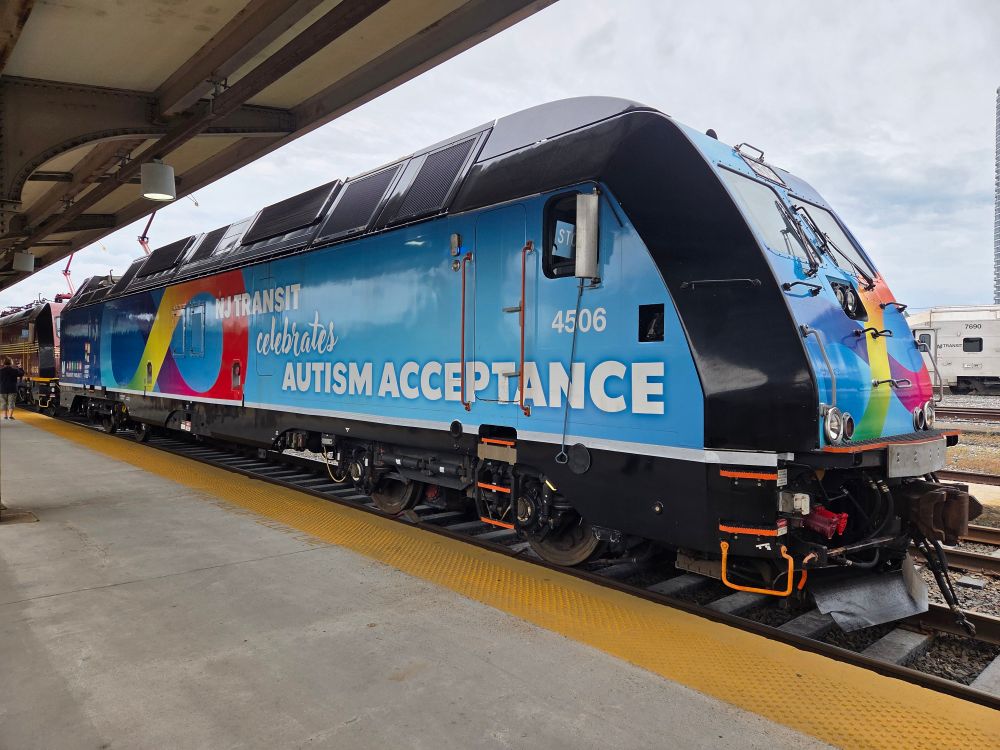 NJT #4506, the autism acceptance locomotive. The wrap features a rainbow infinity sign.