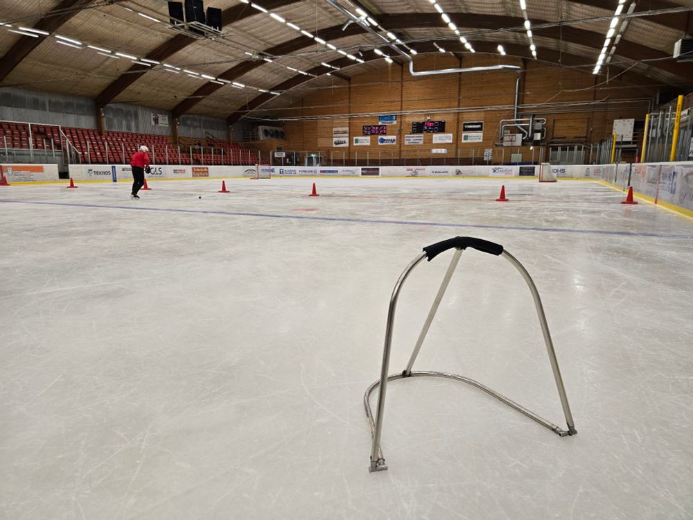An ice rink with equipment to help children to learn to skate