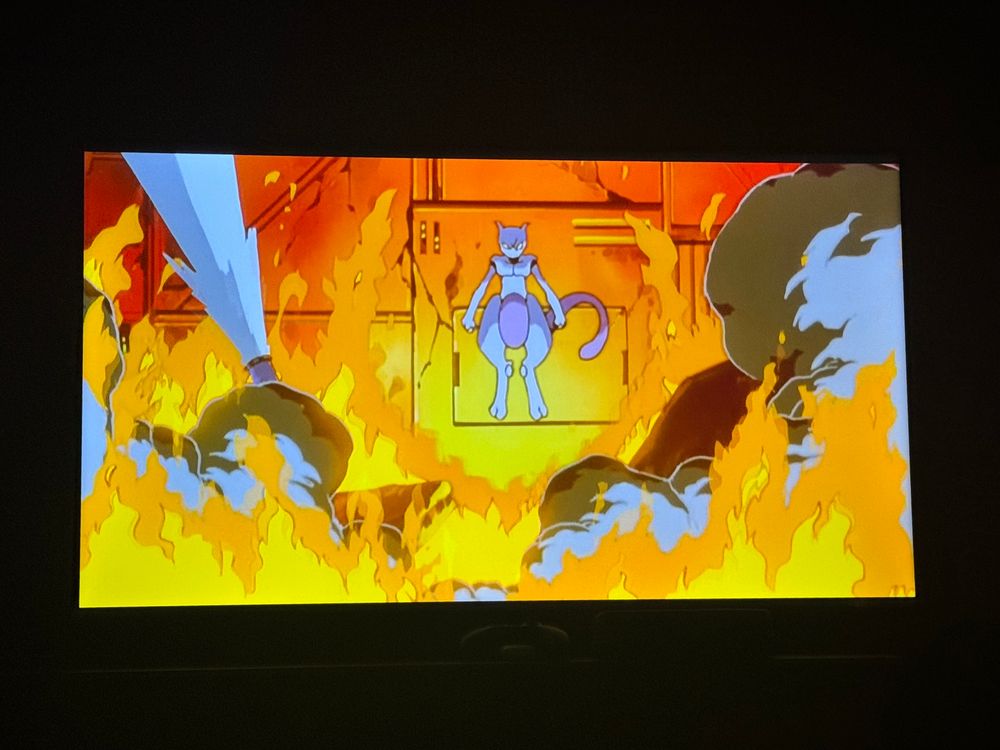 tv picture of “pokemon the first movie: mewtwo strikes back” of mewtwo surrounded by fire