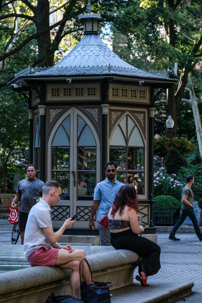 People sitting and walking in a park