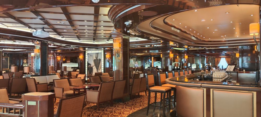 One of the inner dining areas on a Princess Cruise ship. It's a Western theme, with leather or wood surfaces, and warm mood lighting. 