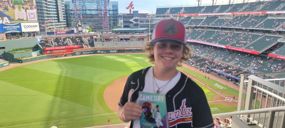 Boy in front of the Atlanta Braves baseball field. So excited he could burst!