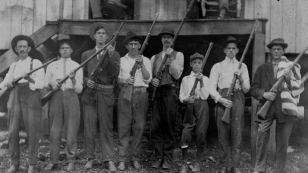 Workers holding rifles during the battle of Blair mountain. The Largest labor uprising in US history