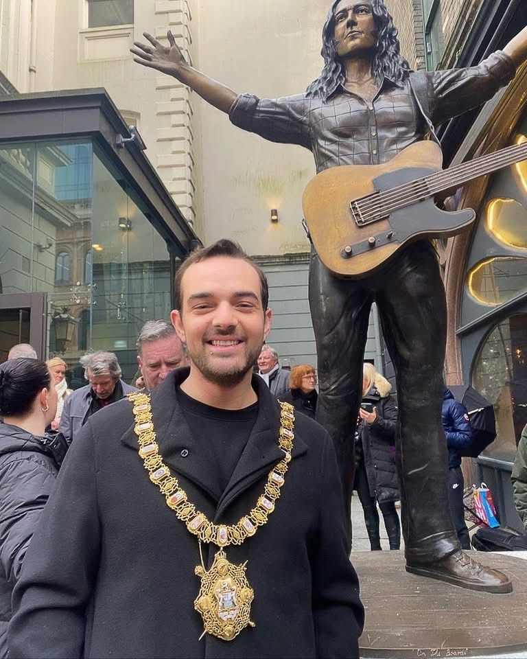 Lord Mayor of Belfast Cllr Micky Murray with the Statue of Rory Gallagher