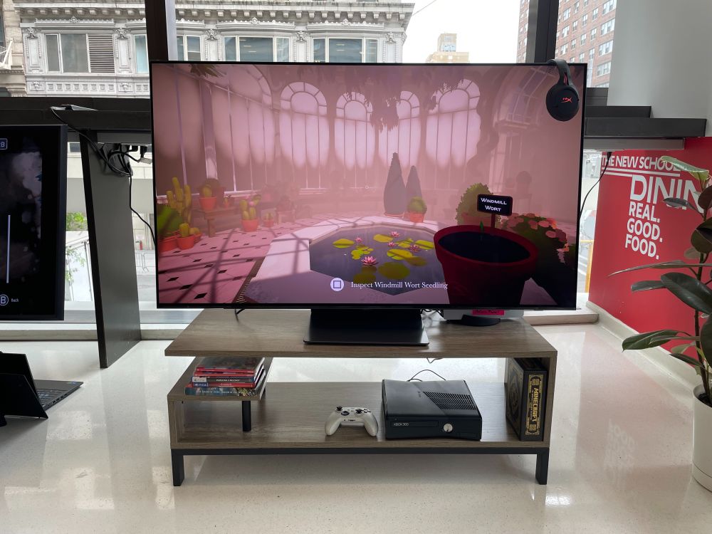TV at the 2025 Games For Change Festival Arcade that has the video game Botany Manor playing.