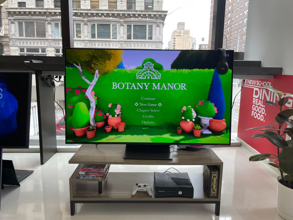 TV at the 2025 Games For Change Festival Arcade that has the video game Botany Manor playing.