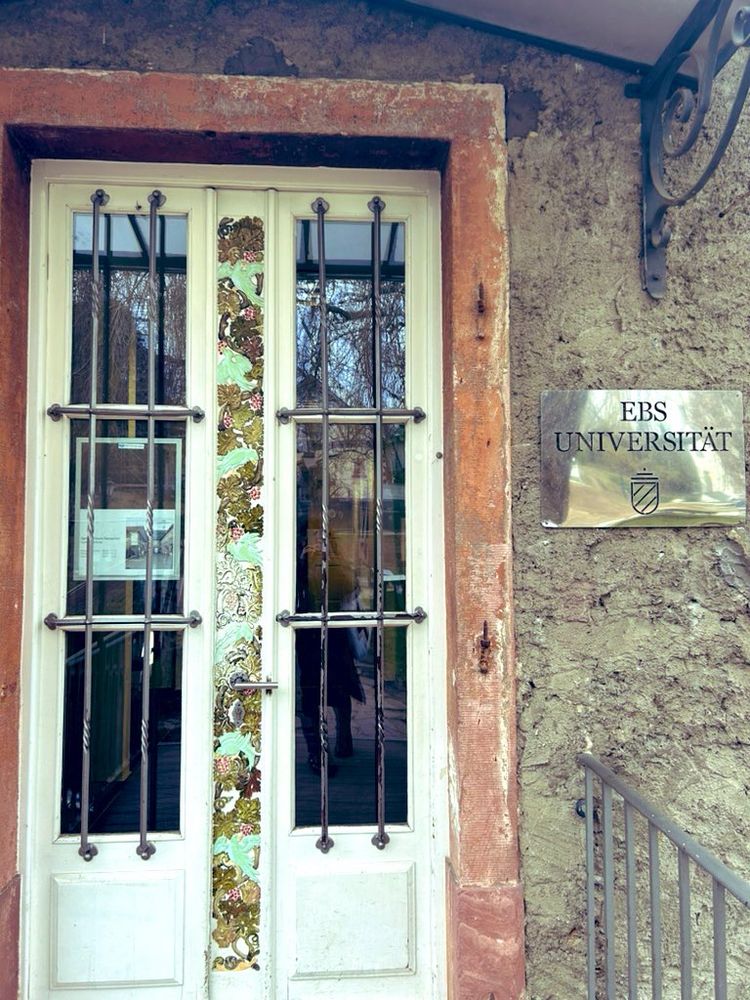 Funky entrance door featuring several materials