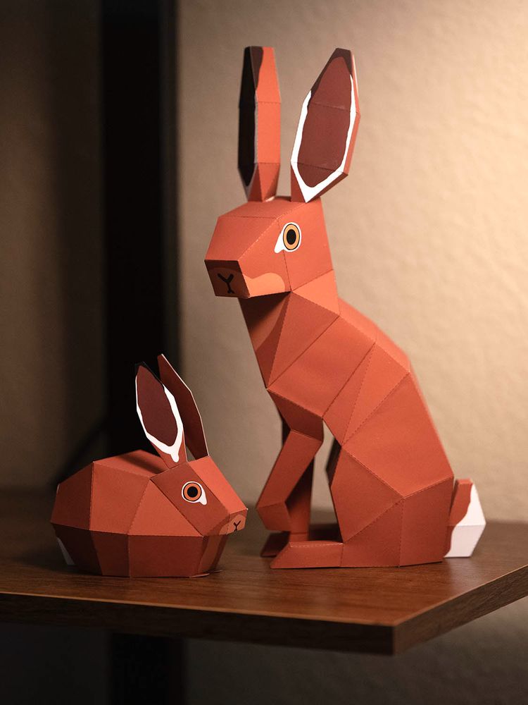 Two papercraft models of brown hares.
