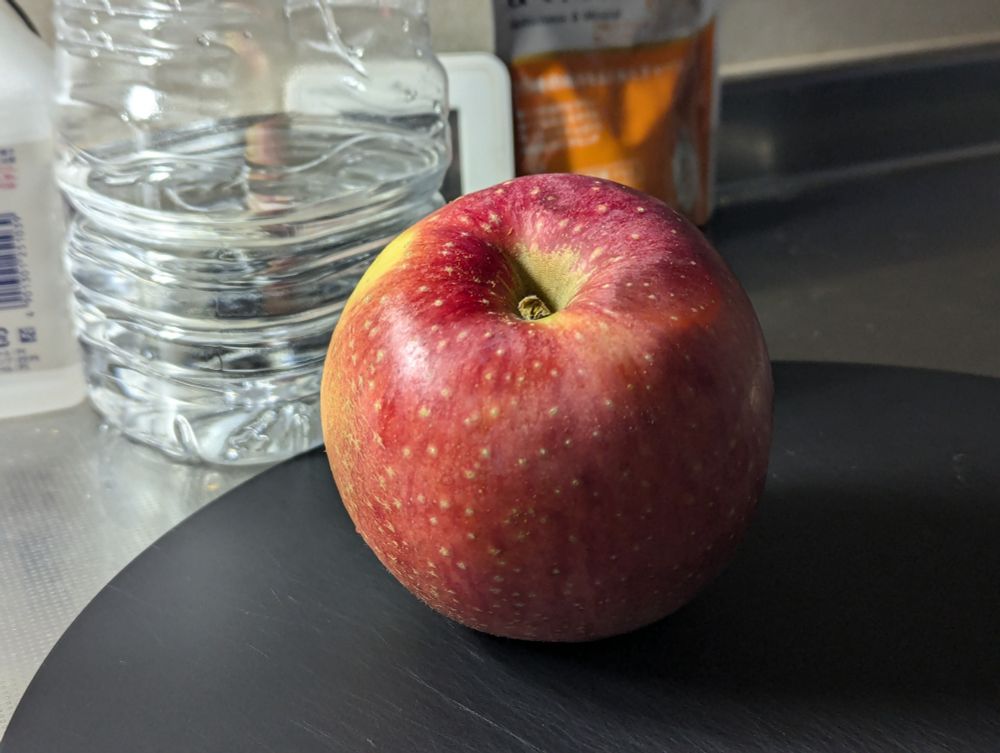 photo of a red apple on the cutting board