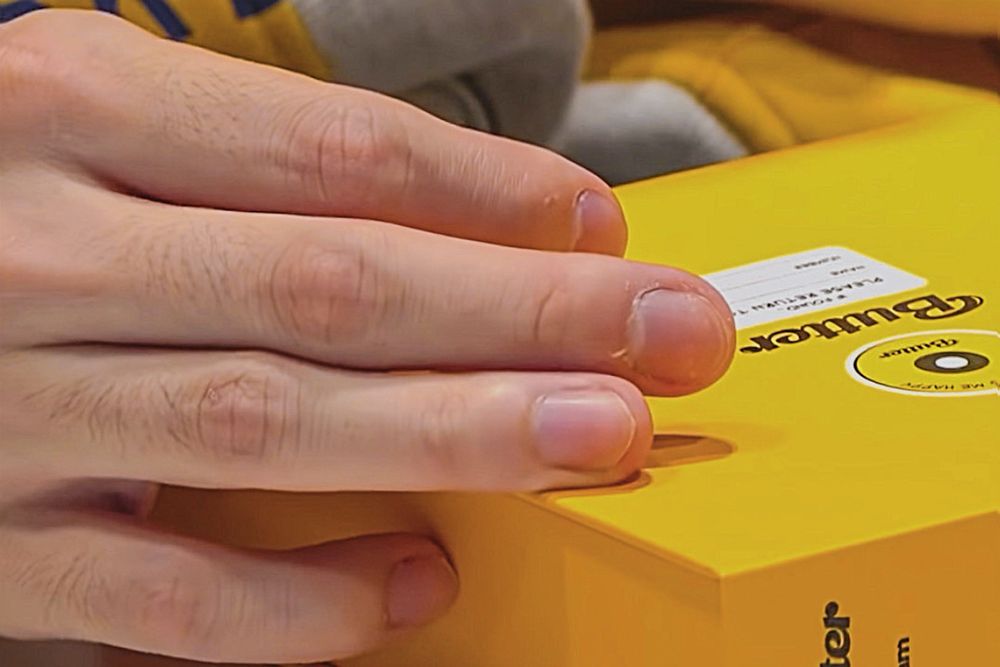 extreme closeup of Yoongi’s fingers holding a Butter album, knuckle hair clearly visible