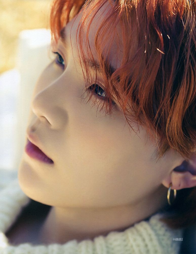 Closeup on Yoongi from his photobook. Soft and beautiful. His nose is utterly perfect.
