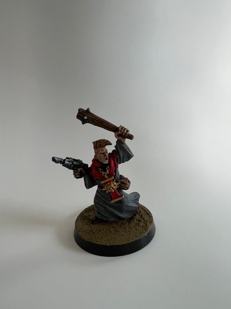 Painted warhammer miniature of an Imperial Preacher.