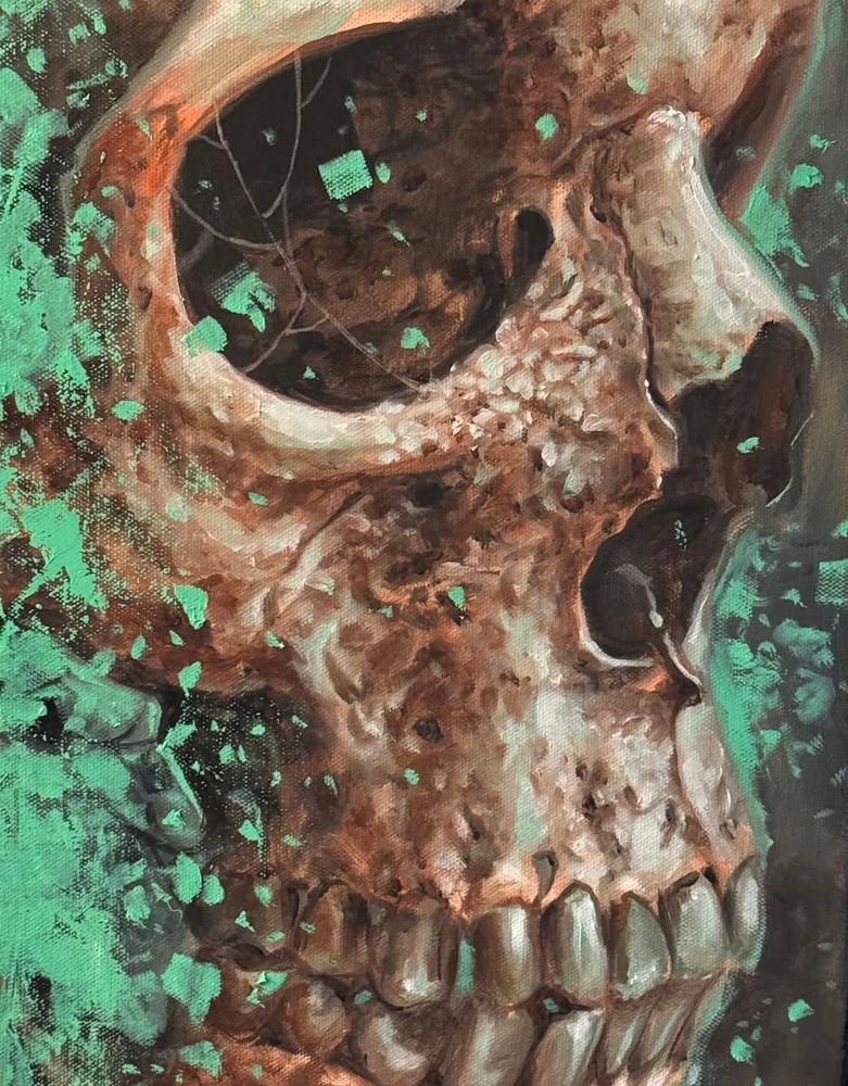Large skull covered in emerald green shards 